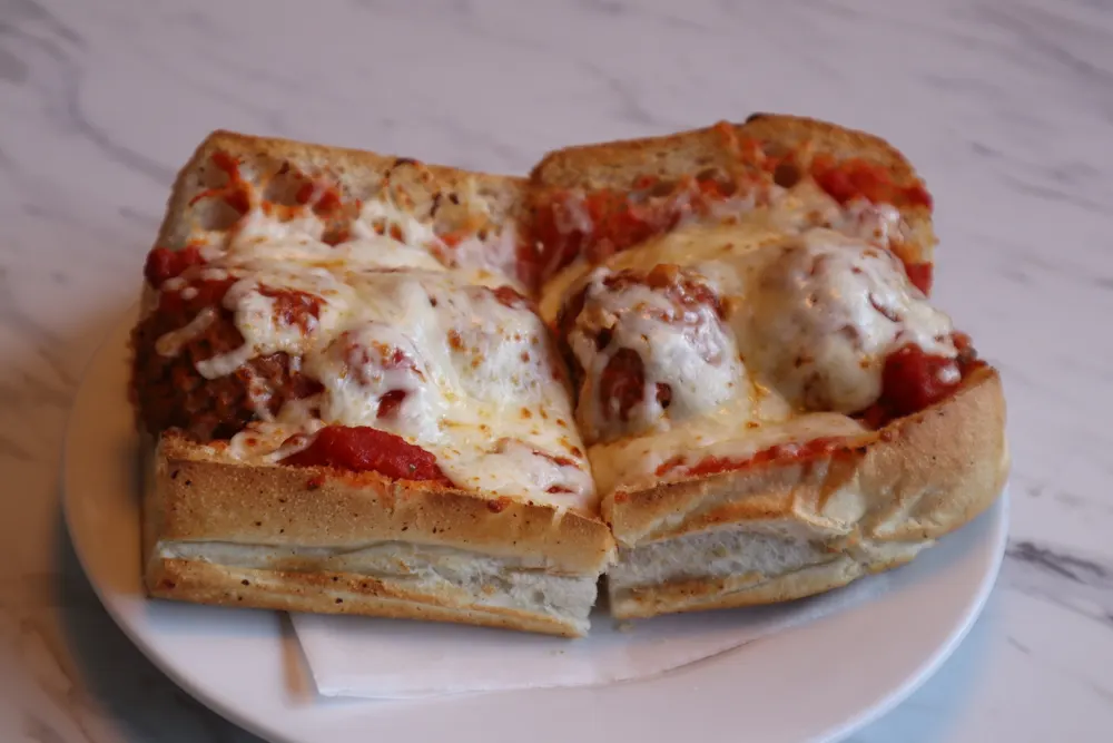 A meatball parm grinder with melted cheese