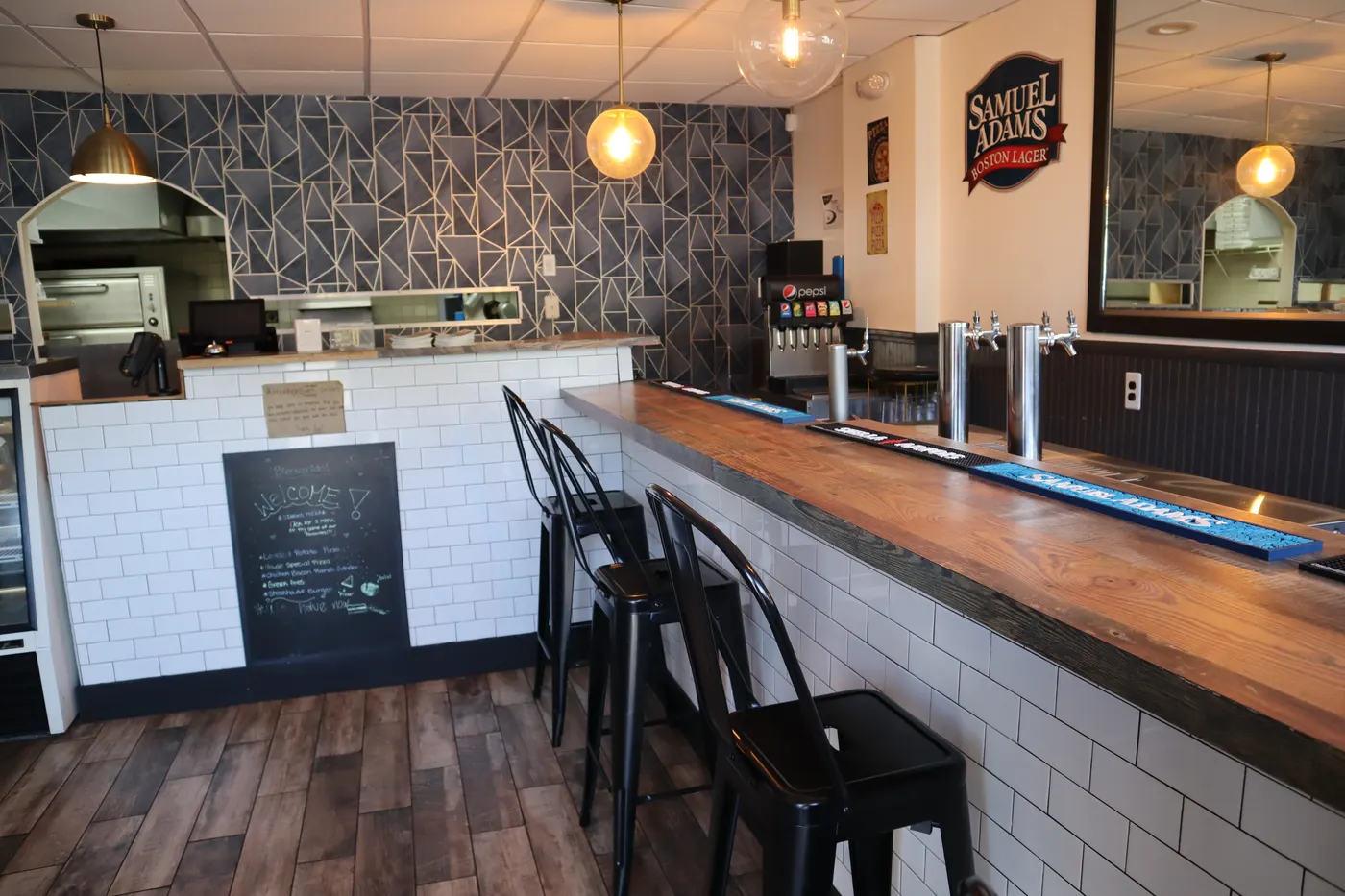 The warm dining room and bar inside Stavros Pizza and Restaurant
